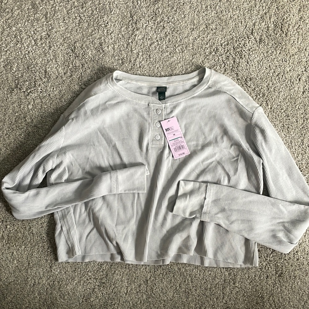 cropped long sleeve half button top